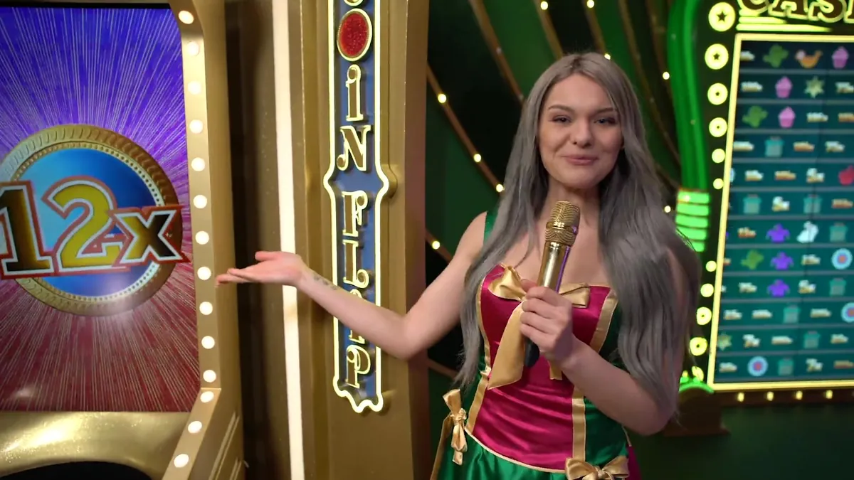 La conduttrice accanto al Coin Flip con un moltiplicatore 12x